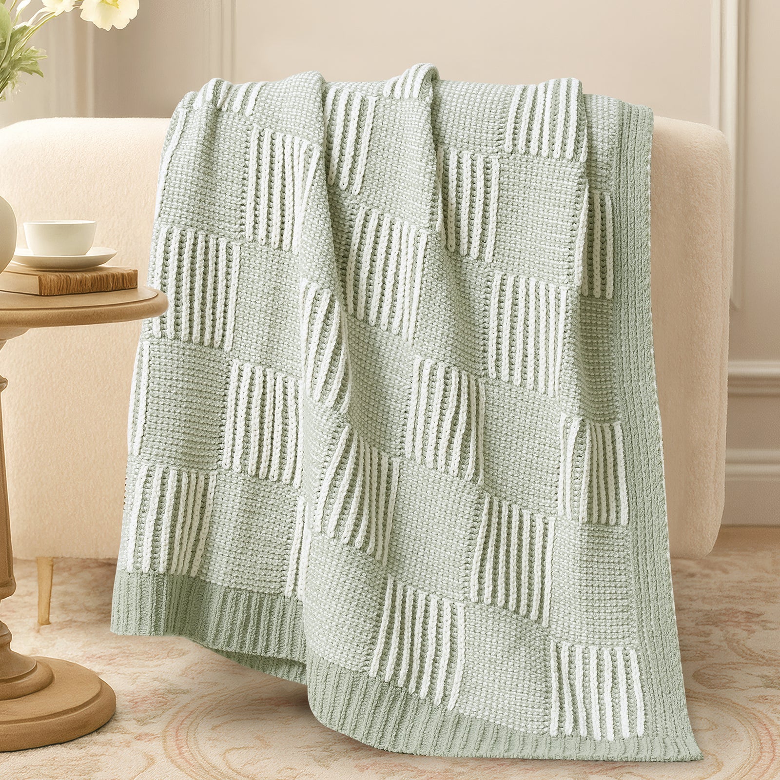 Two tone checkered chenille knit throw blanket in Sage Green draped over sofa creating a warm and inviting look #color_Sage Green