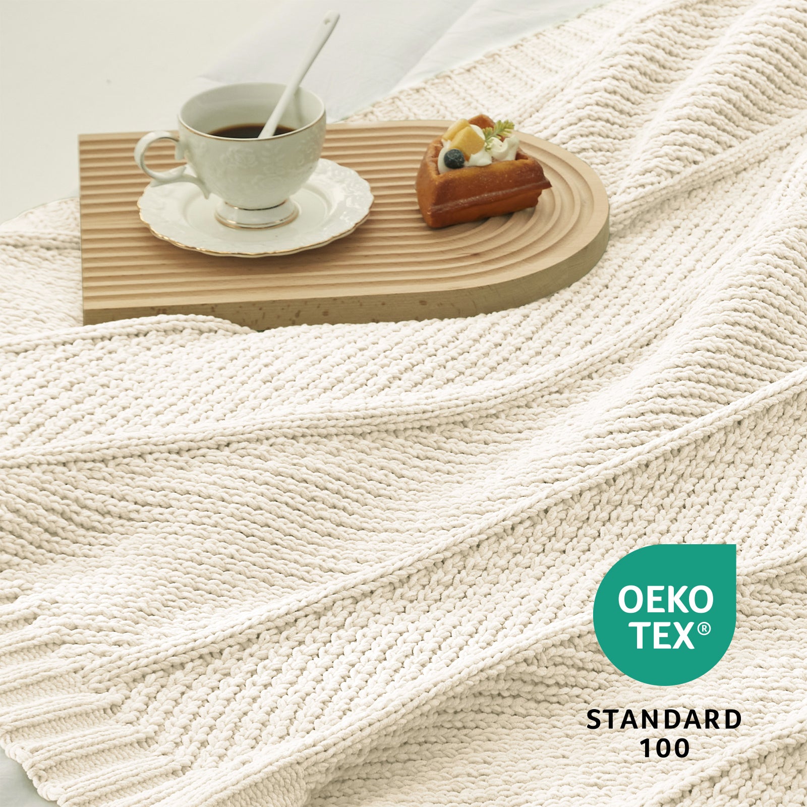 Close up of chevron chenille knit throw blanket in Ivory showing textured weave and OEKO TEX STANDARD 100 certification #color_Ivory