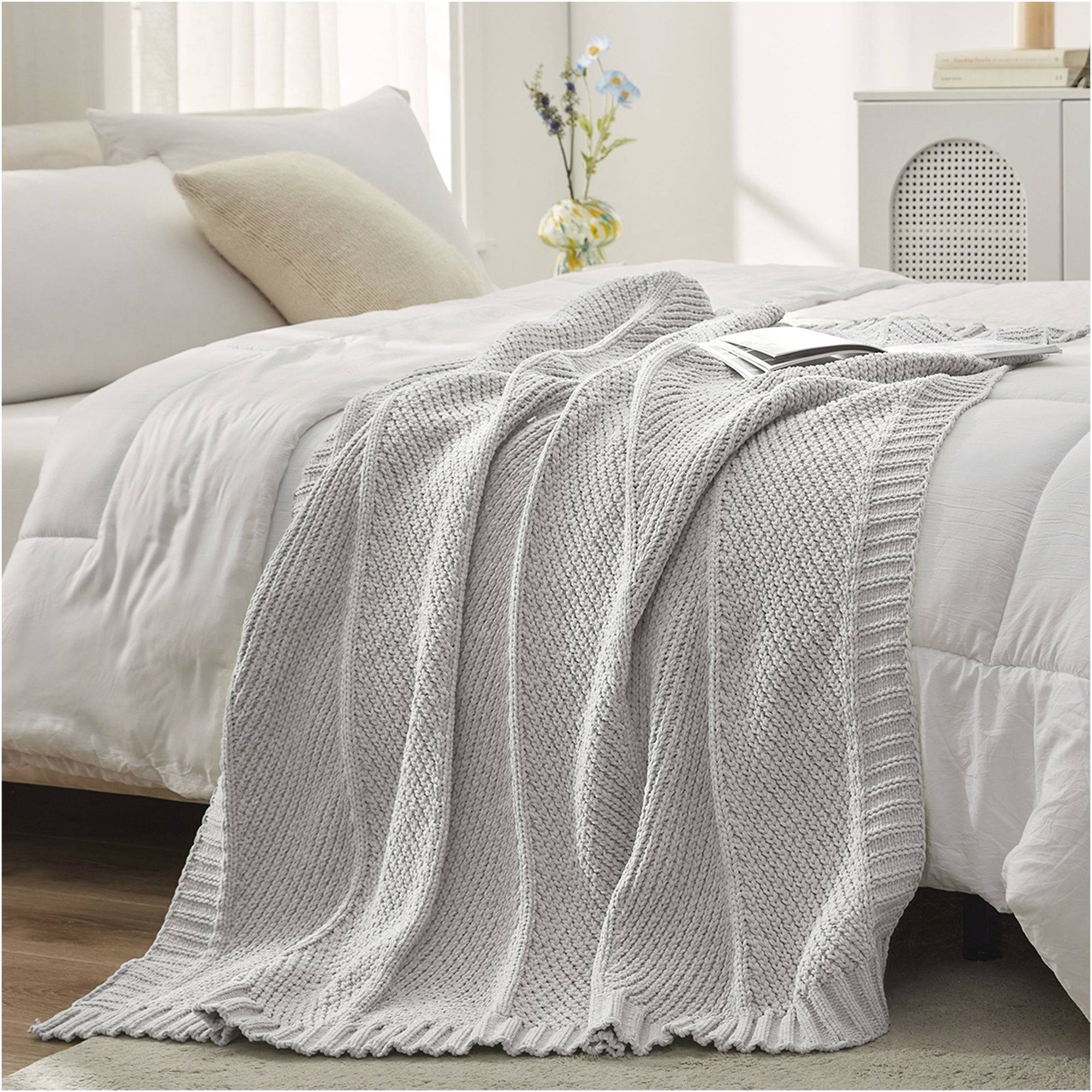 Chevron chenille knit throw blanket in Light Grey layered on bed creating a soft and cozy bedroom look #color_Light Grey