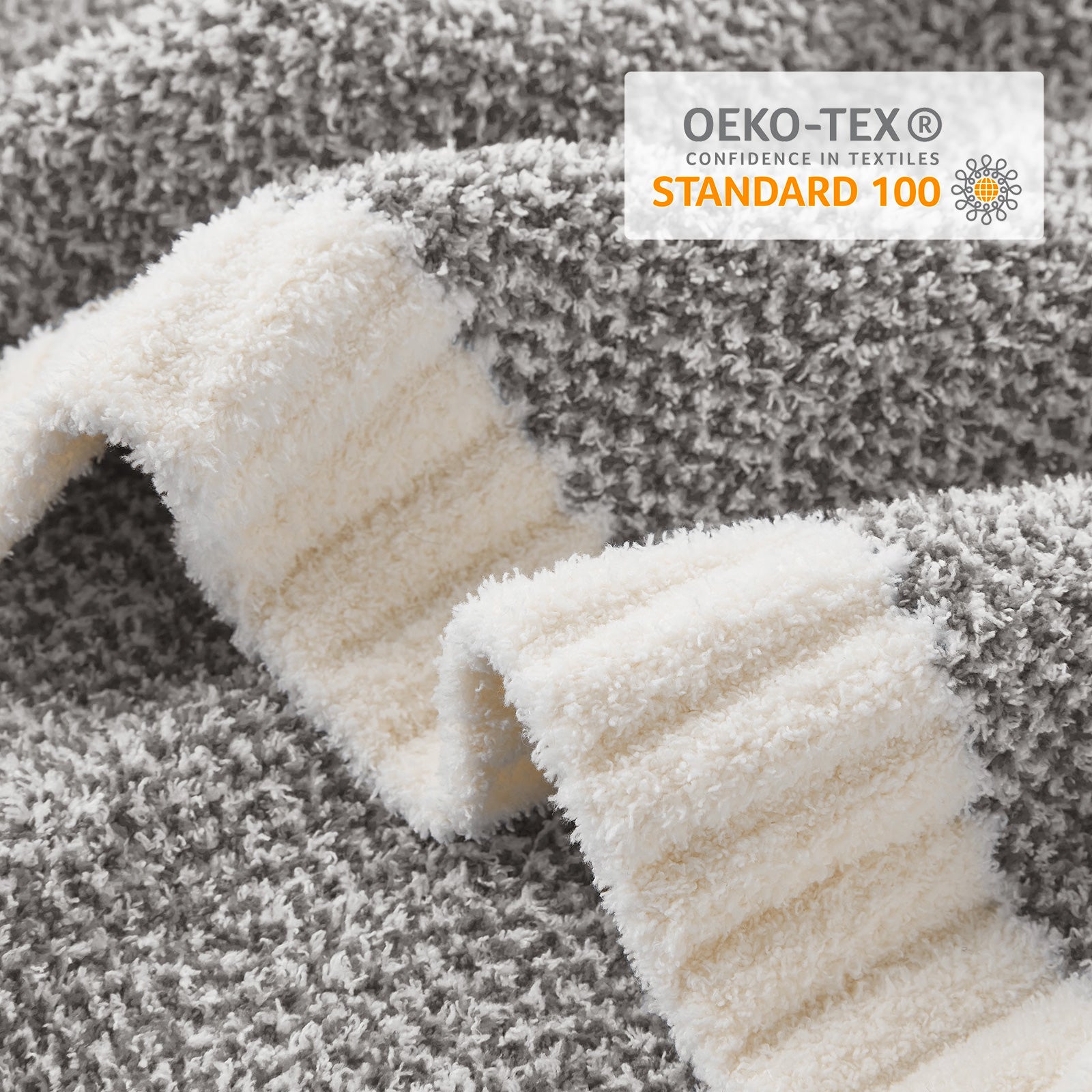 Textured fabric with OEKO-TEX Standard 100 label on a textured background #color_Dark Grey