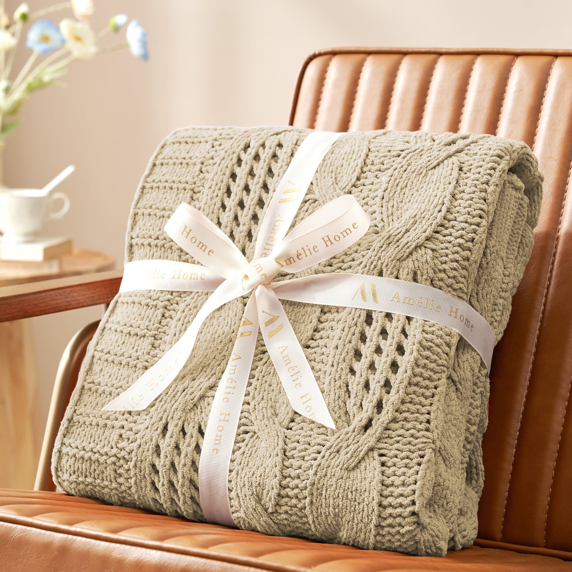 Cable chenille knit throw blanket in Beige folded with ribbon perfect for gifting #color_Beige