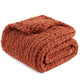 Snuggle Sac solid yarn chunky knit throw blanket in Burnt Orange neatly folded front view #color_Burnt Orange