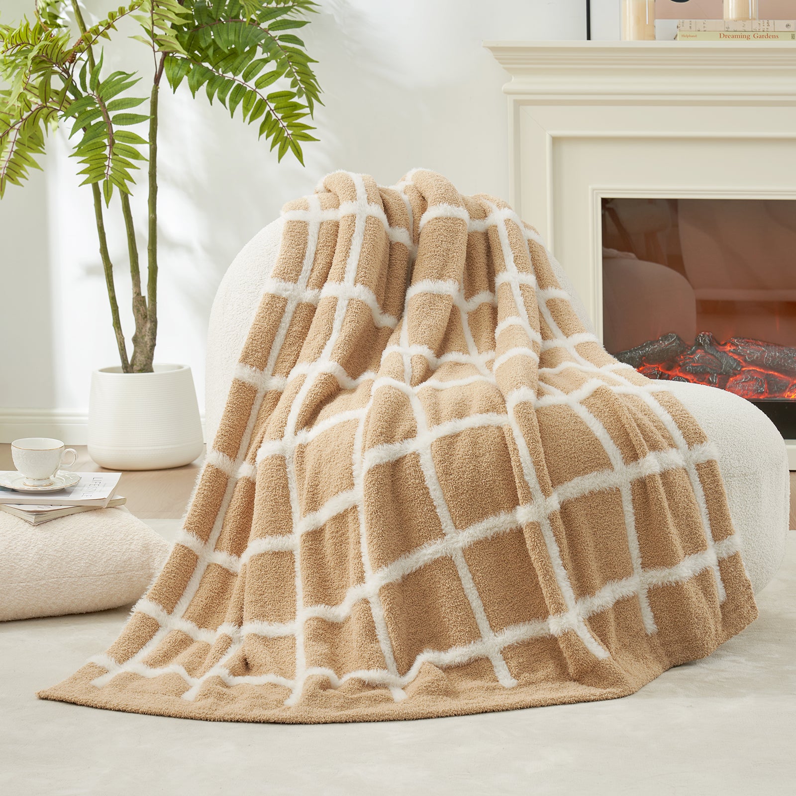 Beige and white faux fur knit throw blanket blanket draped over a couch in a cozy living room.#color_Beige
