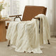 Snuggle Sac cable chenille knit throw blanket in Ivory draped over a chair creating a cozy corner #color_Ivory