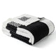 Folded black and white checkered blanket on a white background #color_Black White
