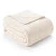 Folded Snuggle Sac Heather Feather Yarn Ivory Knit Throw Blanket front view #Color_Ivory