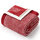 Folded red and white blanket with a logo on a white background #color_Red/Cream