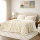 Snuggle Sac Cooling comforter in khaki on bed in a bedroom with windows,plant and a view behind
#color_Khaki