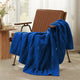 Snuggle Sac cable chenille knit throw blanket in Navy Blue draped over a chair creating a cozy corner #color_Navy Blue