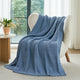 Snuggle Sac chevron chenille knit throw blanket in Blue casually draped over a chair in a cozy setting #color_Blue