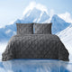 Snuggle Sac Cooling comforter in charcoal grey on bed in a bedroom with mountains in snow as a view behind#color_Charcoal Grey