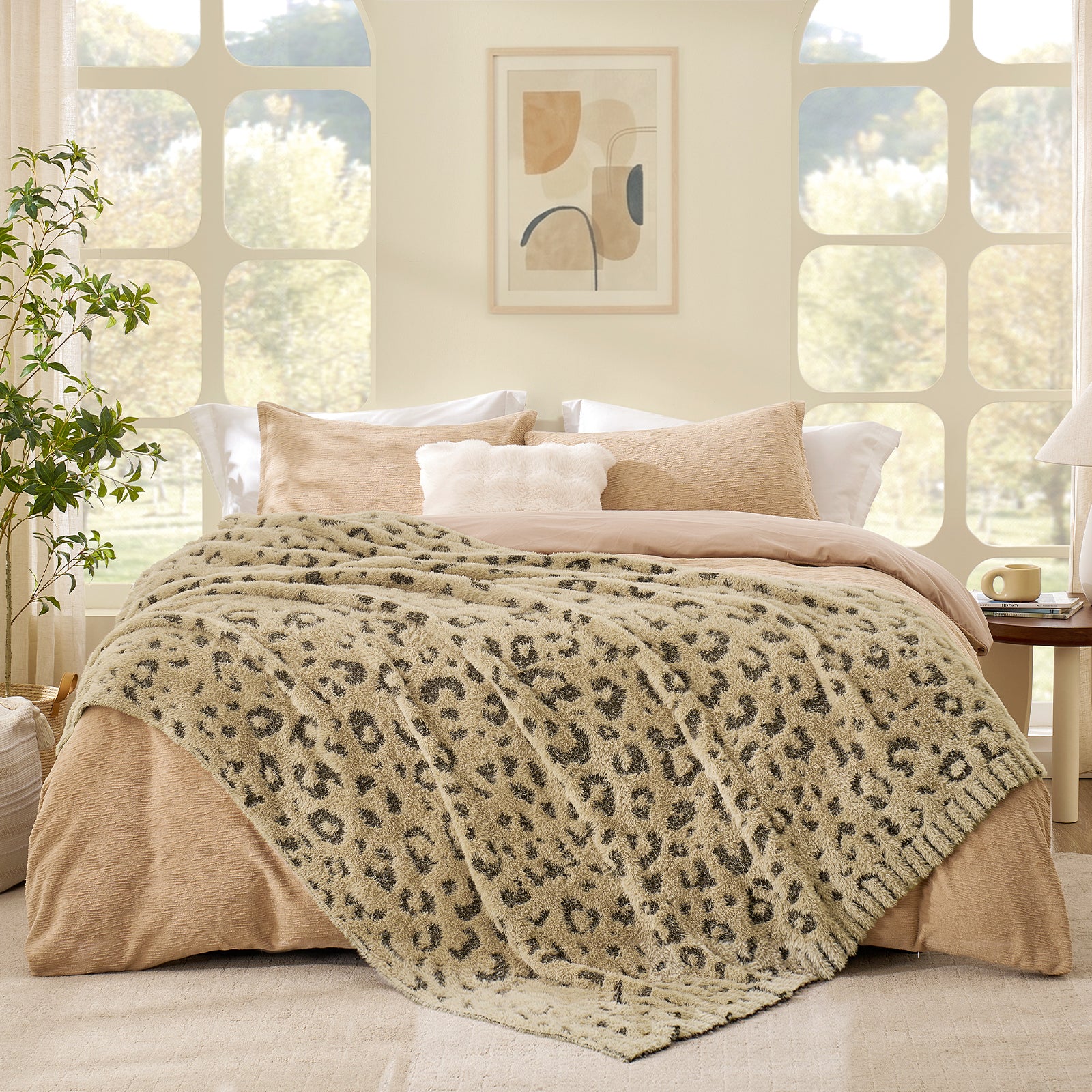 Brown Leopard faux fur knit throw blanket in layered on a bed, creating a warm and inviting bedroom look #color_Brown Leopard
