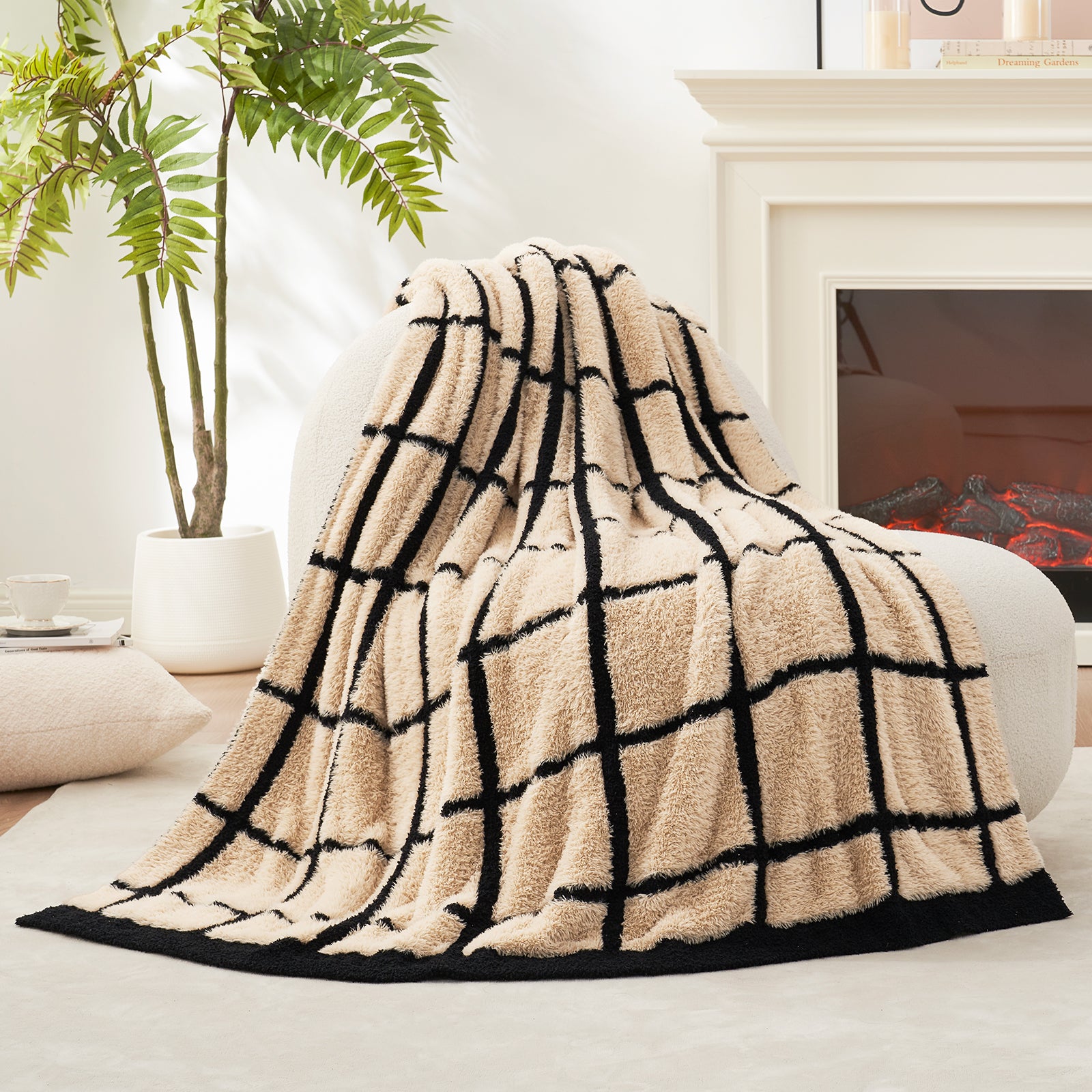 Beige and black checkered faux fur knit throw blanket draped over a couch in a living room setting.#color_Black