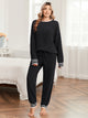 Snuggle Sac women long sleeve crewneck knit loungewear set in Black, styled with a cozy and effortless homewear aesthetic #color_Black
