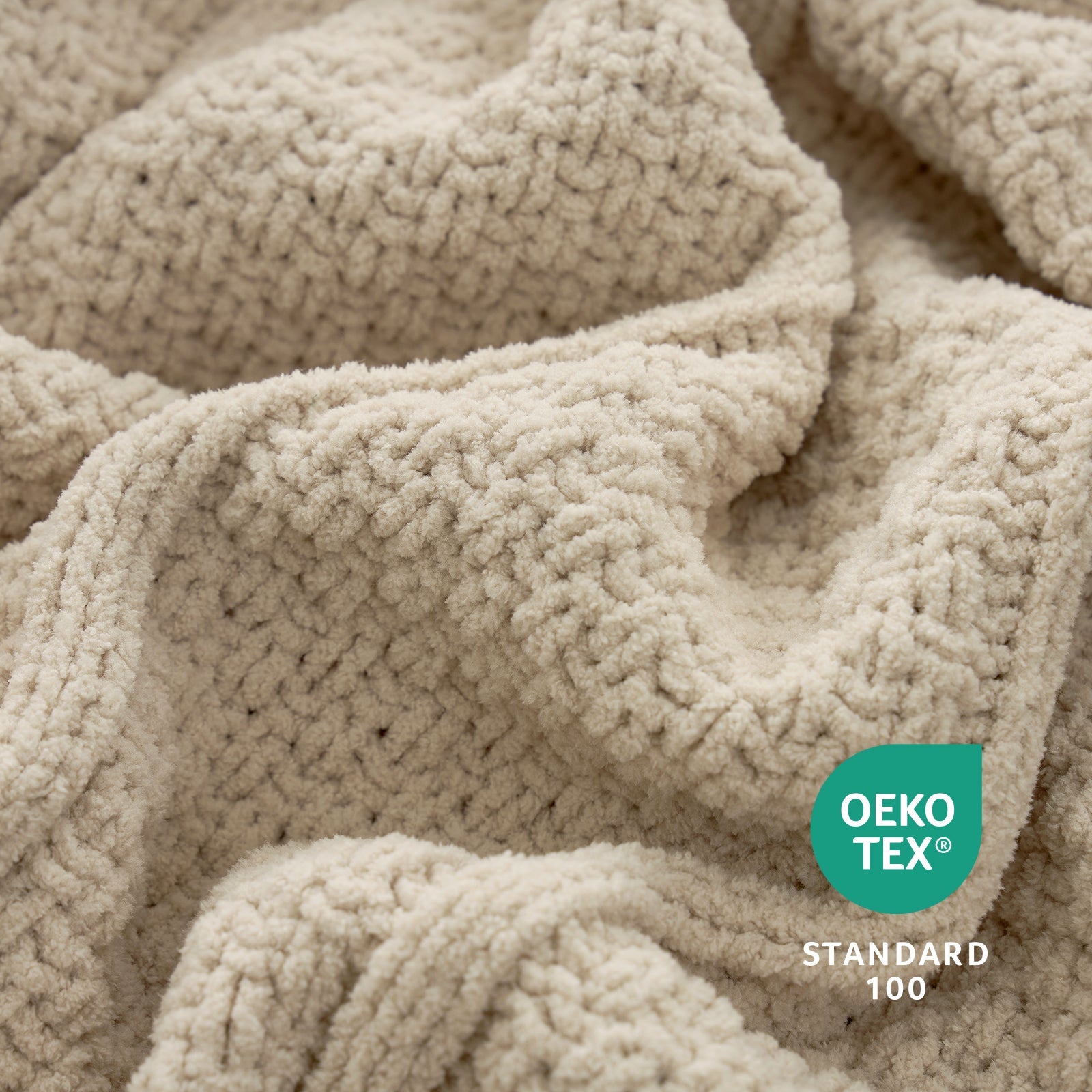 Close-up of a textured beige fabric with OEKO-TEX Standard 100 logo. #color_Beige