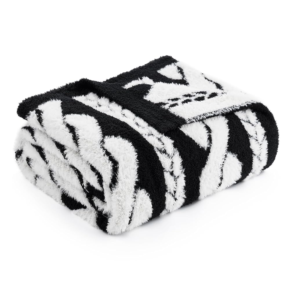 Cable pattern Faux Fur Knit Throw Blanket in Black and white front view.