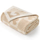 Folded beige and white textured blanket on a white background #color_Cream/Beige