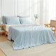 Bedroom view at 45 degrees, featuring a Snuggle Sac grey/blue cooling comforter on the bed for hot sleepers#color_Grey/Blue