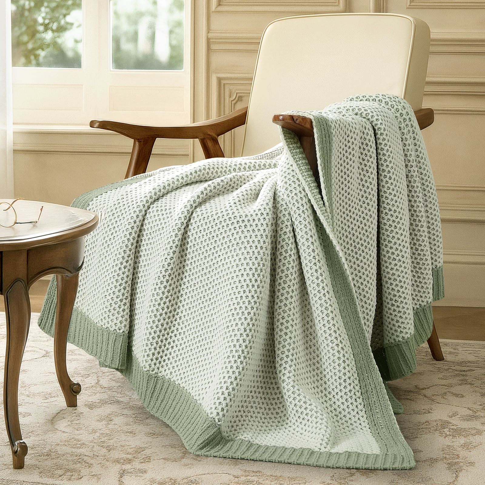 Snuggle Sac two tone chenille knit throw blanket in Sage Green draped over a chair creating a relaxed and cozy corner #color_Sage Green