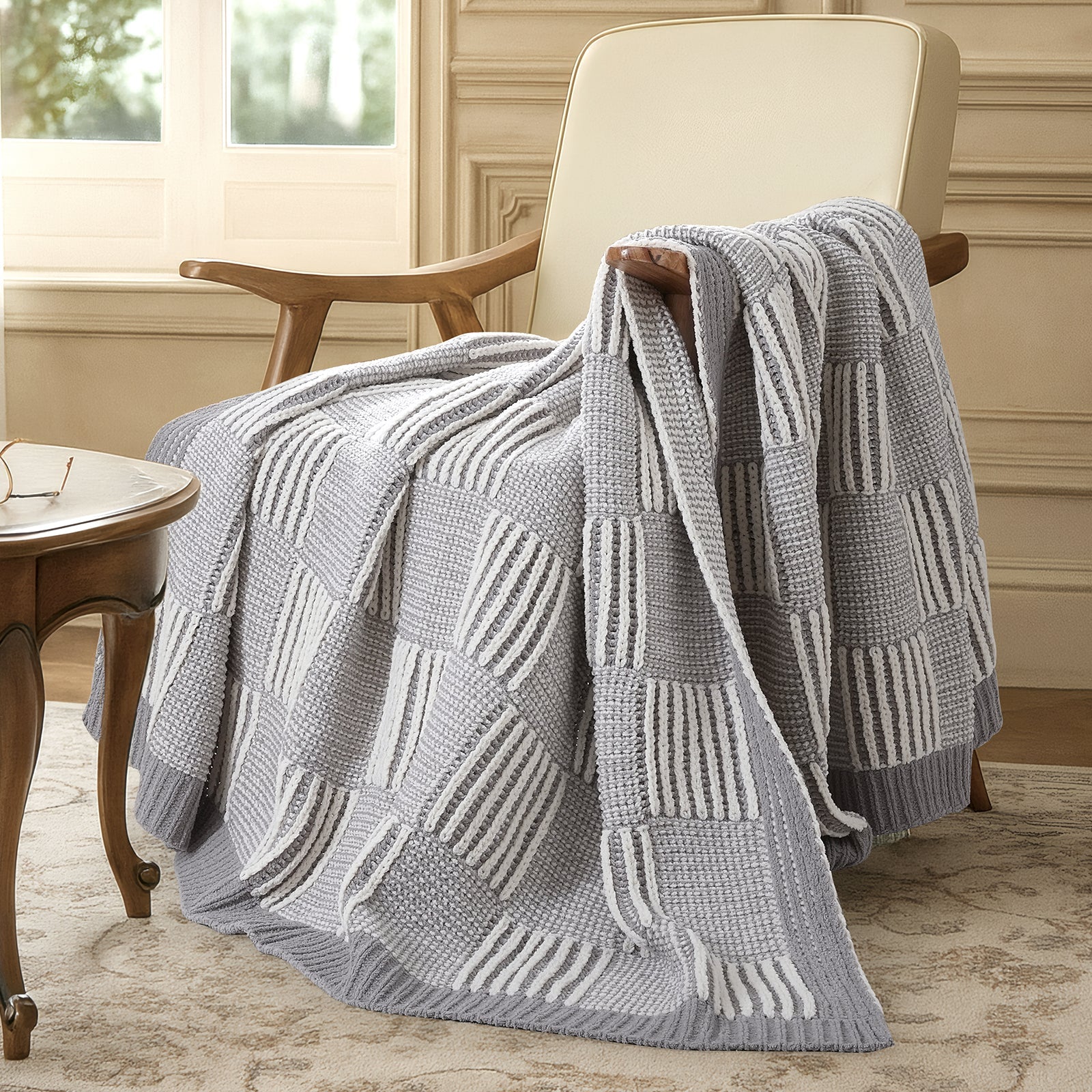 Snuggle Sac two tone checkered chenille knit throw blanket in Gray draped over a chair creating a cozy corner #color_Gray