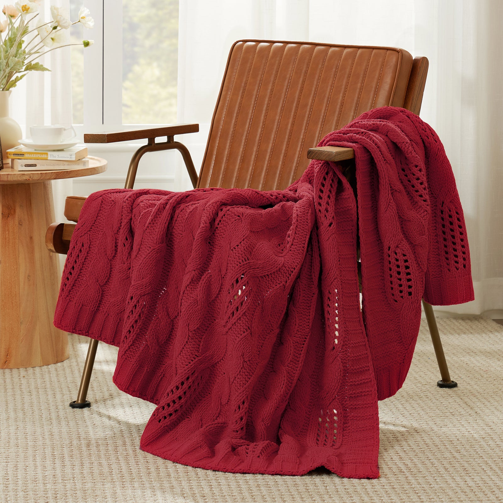 Snuggle Sac cable chenille knit throw blanket in Red draped over a chair creating a cozy corner #color_Red