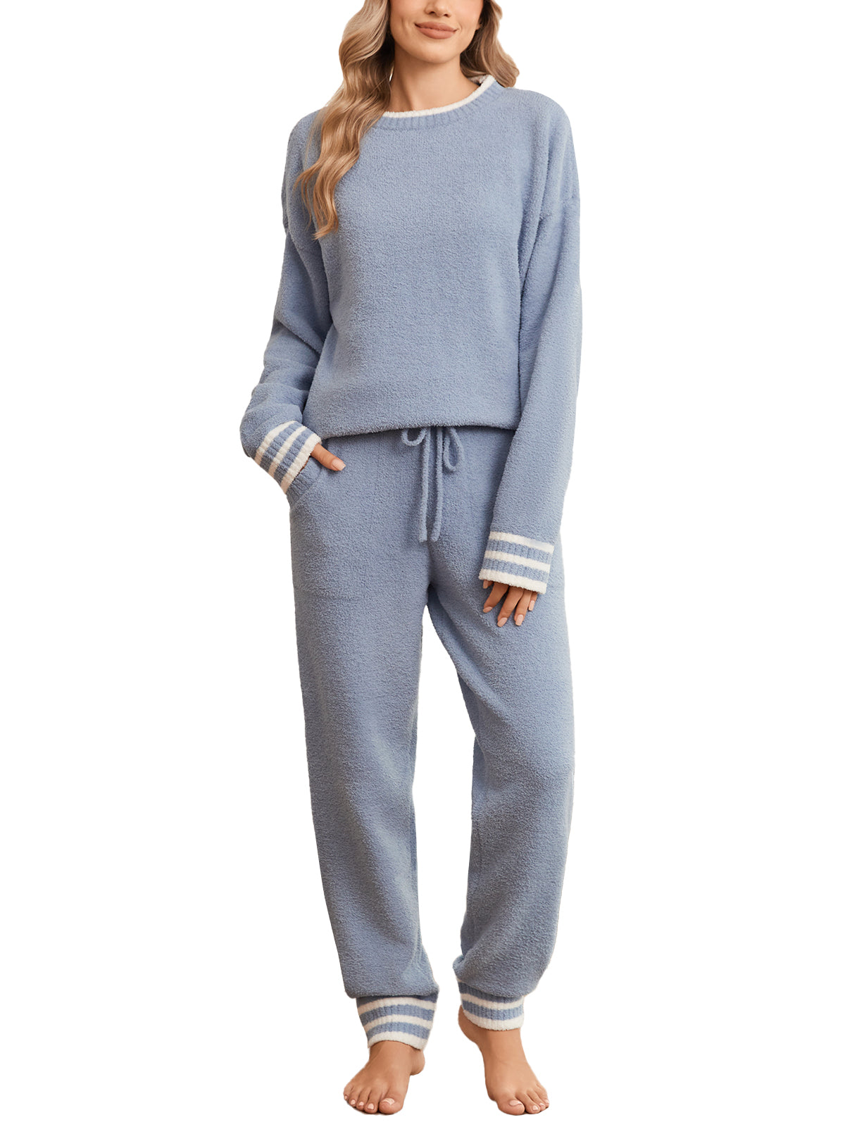 Woman wearing a blue pajama set with striped cuffs on a white background #color_Blue