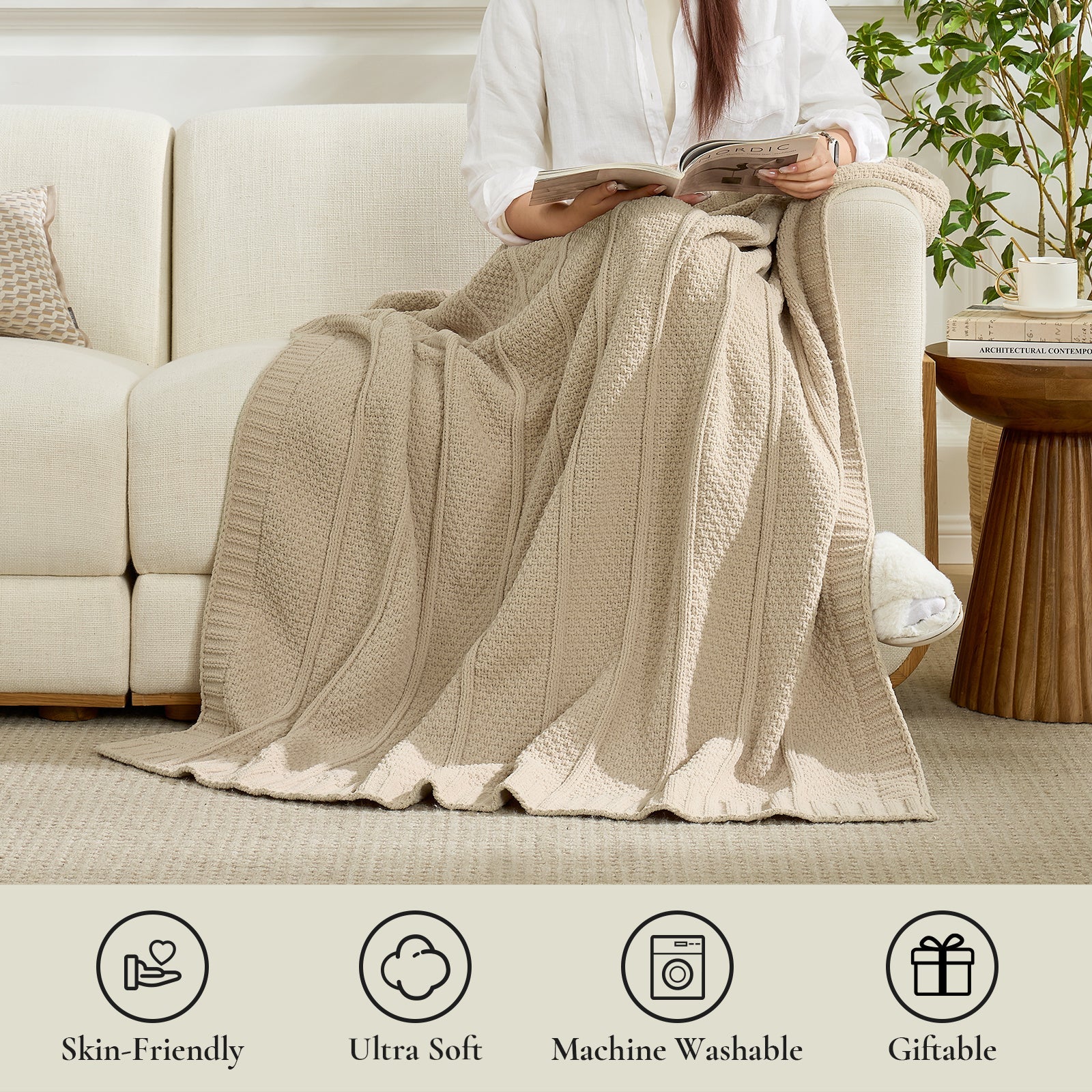 Person sitting on a couch with a beige blanket, reading a book, in a cozy living room setting. #color_Beige