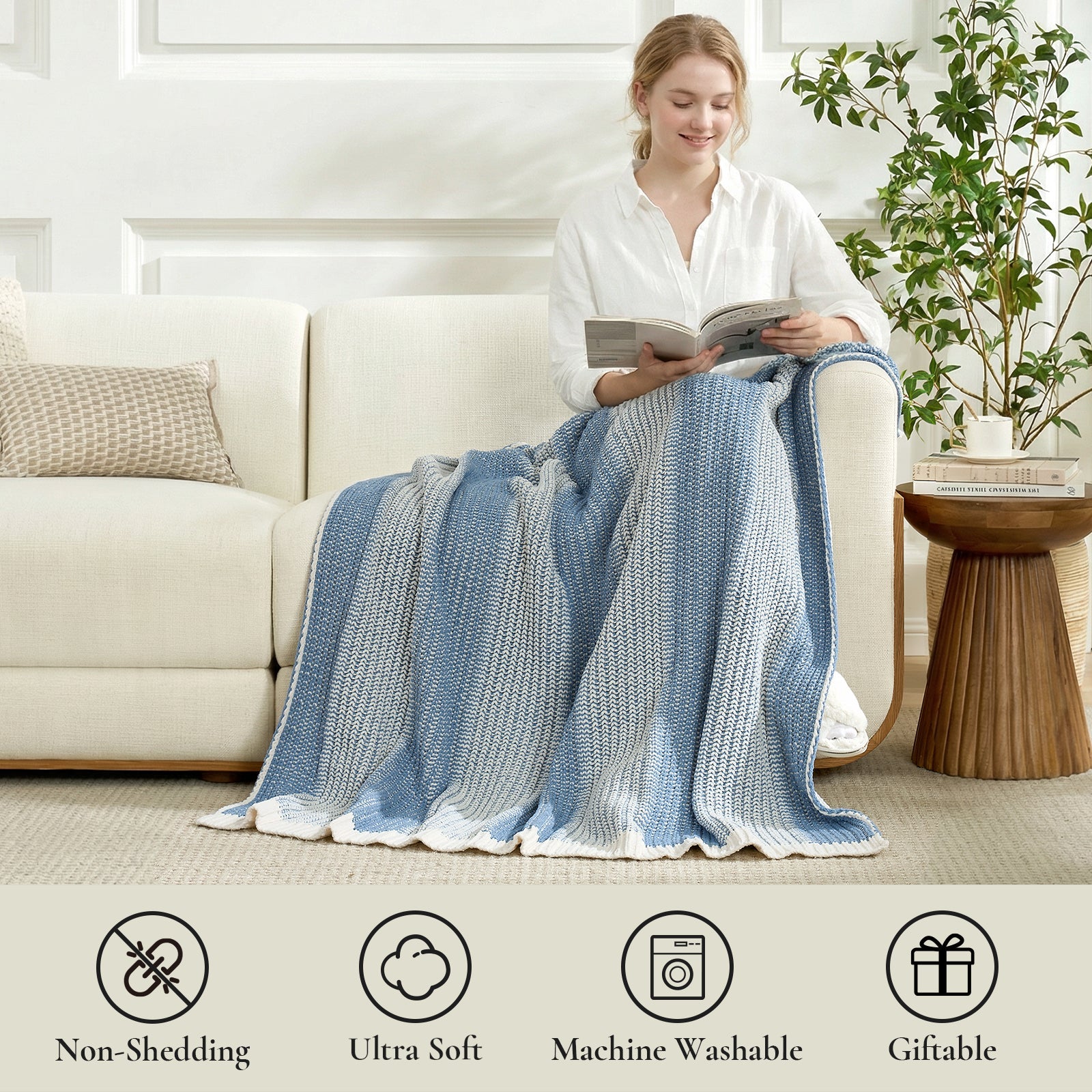 Woman sitting on a couch with a blue and white knitted blanket, reading a book. #color_Two-tone Blue