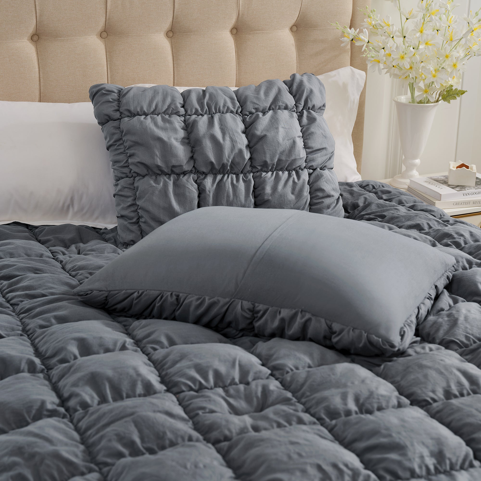 Close up of pillow of Snuggle Sac All-Season Bubble Comforter Set in dark grey on bed#color_Dark Grey