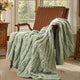 Snuggle Sac cable chenille knit throw blanket in Sage Green draped over a chair creating a cozy corner #color_Sage Green