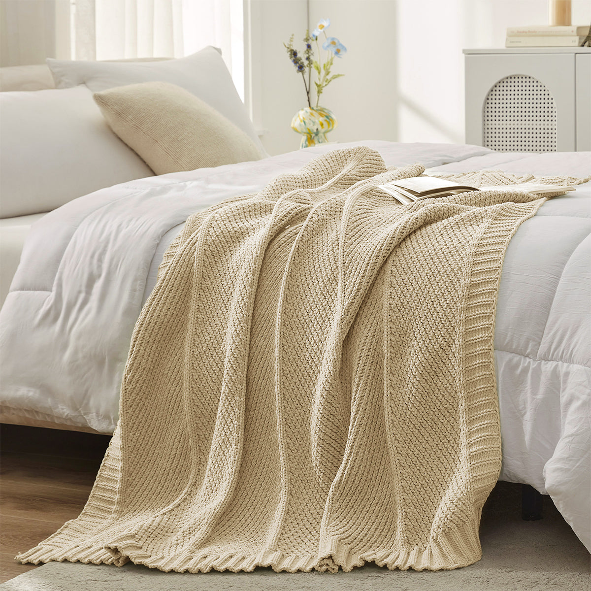 Chevron chenille knit throw blanket in Beige layered on bed creating a soft and cozy bedroom look #color_Beige
