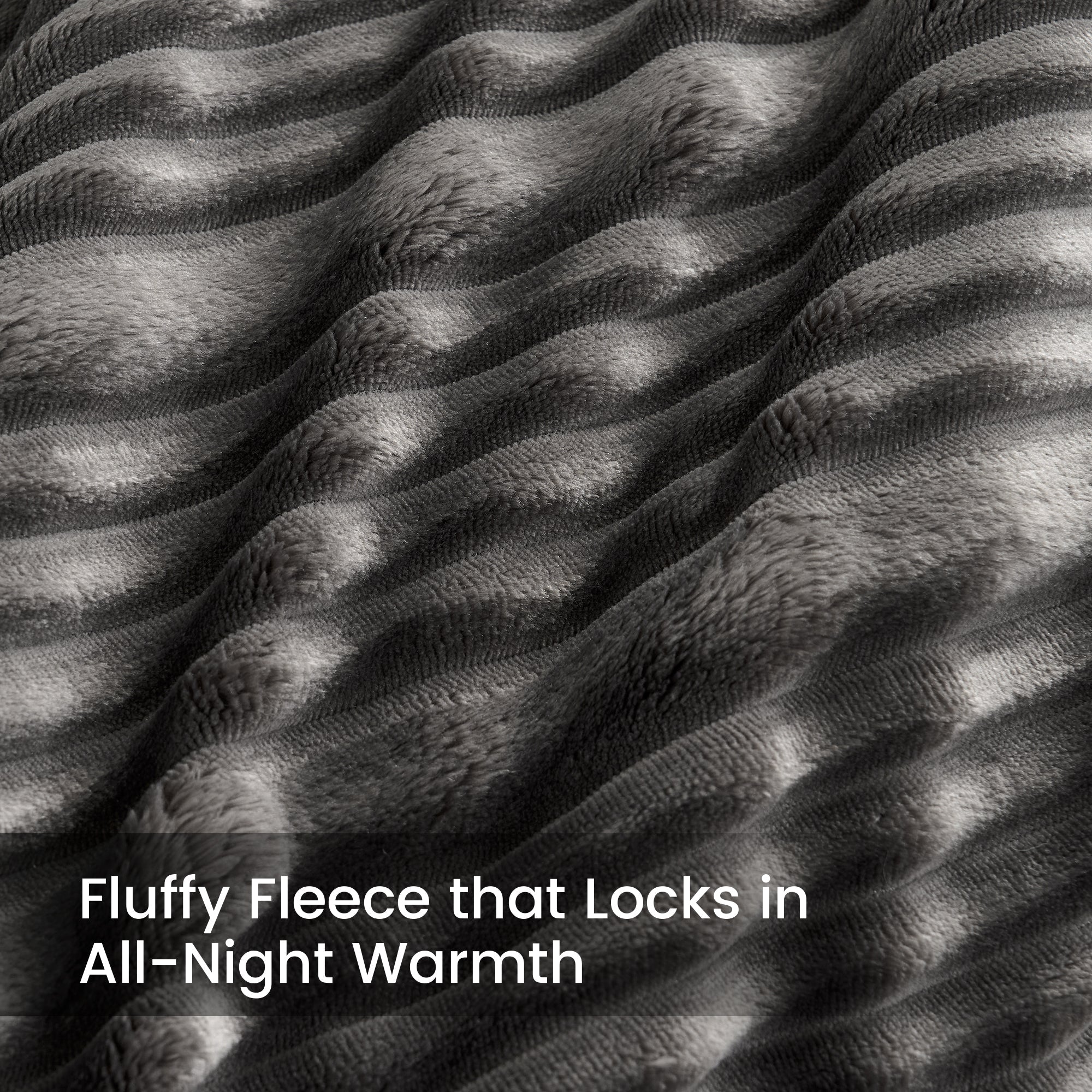 Close-up of fluffy fleece fabric with text 'Fluffy Fleece that Locks in All-Night Warmth'.#color_Dark Grey