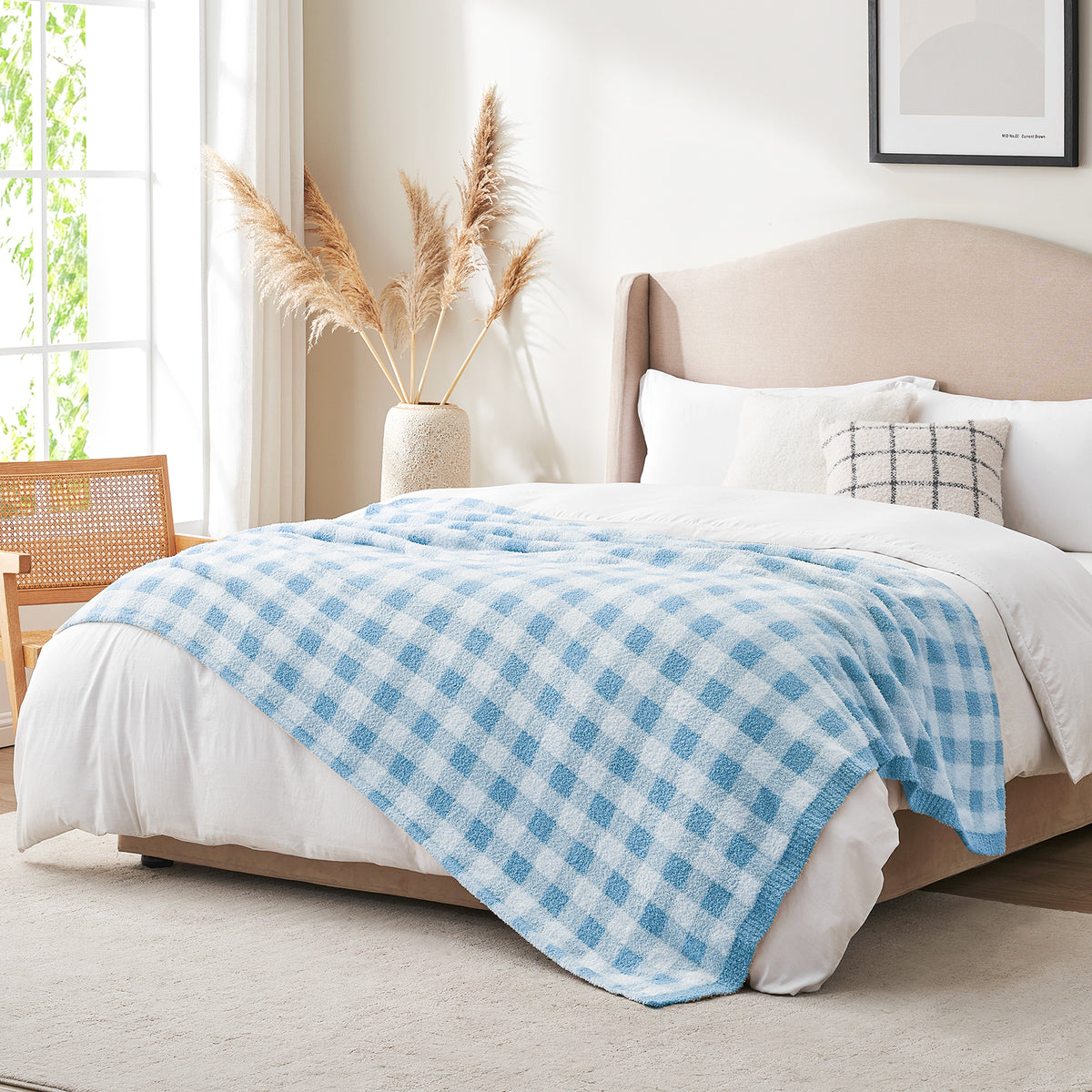 Side view of Blue and white checkered blanket in a bright room with a vase of plants and window #color_Ice Blue