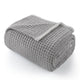 Folded Soft Waffle Feather Yarn Knit Throw Blanket with a white background #Color_Grey