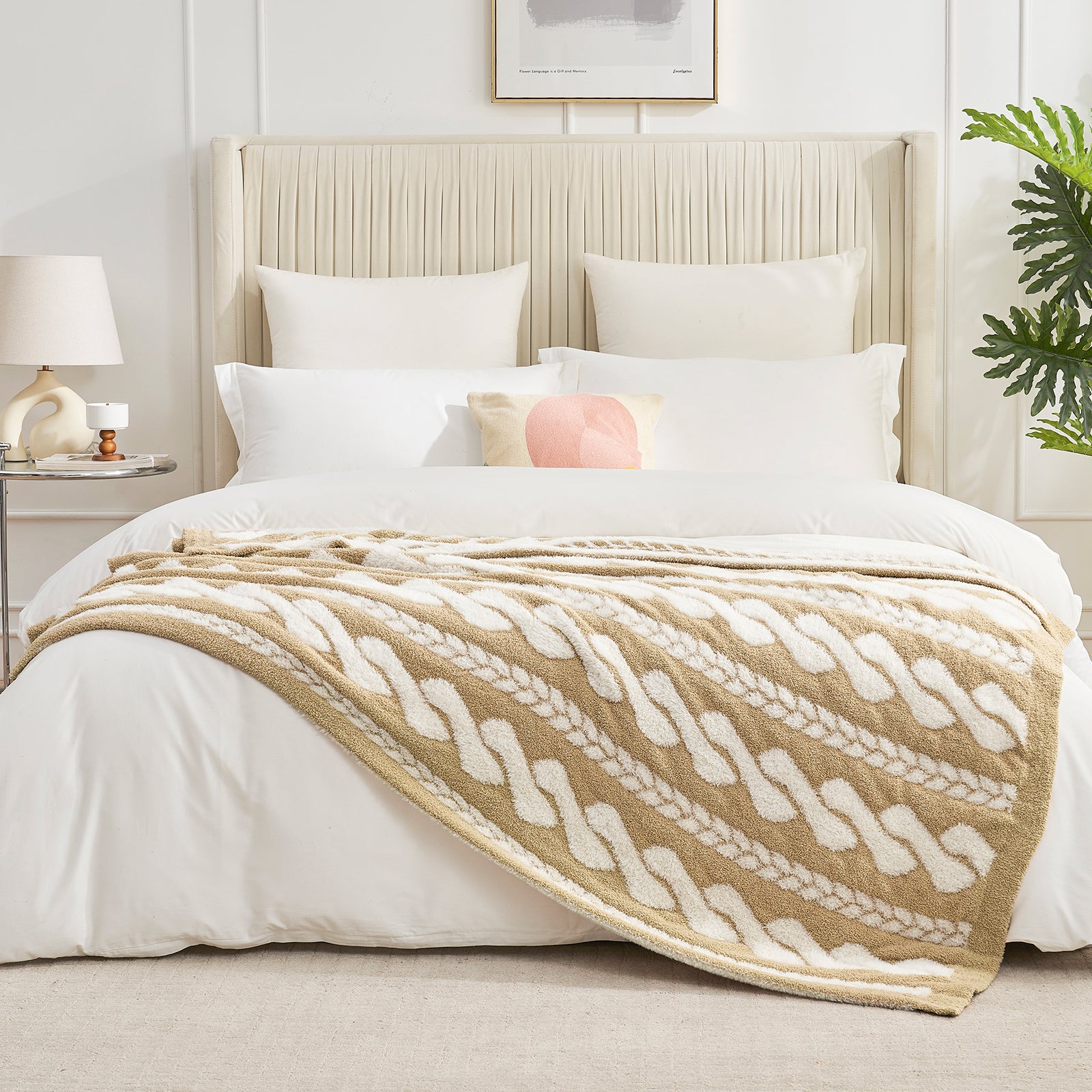 Cable pattern Faux Fur Knit Throw Blanket in beige and white on a bed in a bedroom setting.#color_Beige