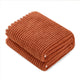 Folded Soft Waffle Feather Yarn Knit Throw Blanket with a white background#color_Orange