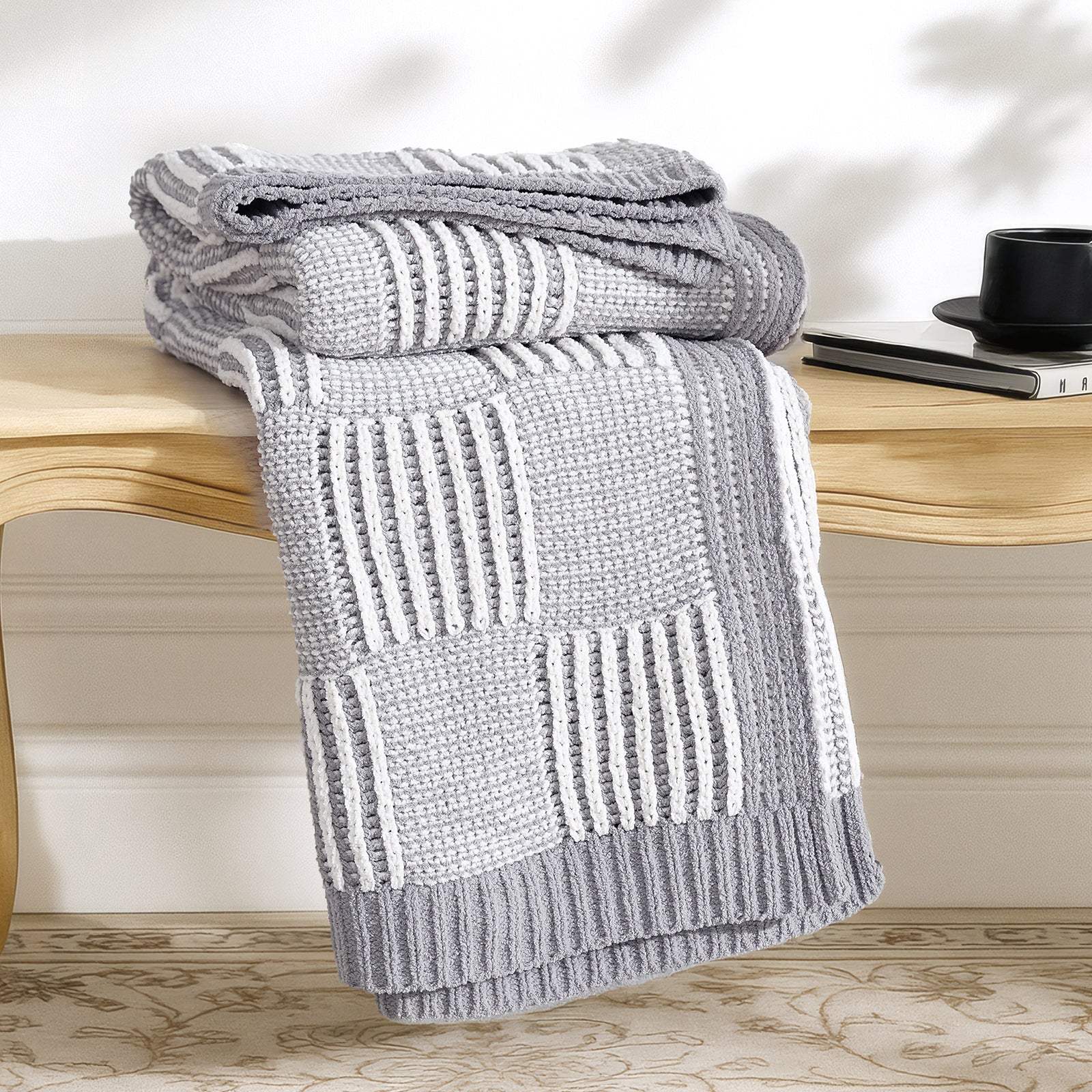 Snuggle Sac two tone checkered chenille knit throw blanket in Gray neatly folded on a wooden table #color_Gray