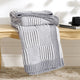 Snuggle Sac two tone checkered chenille knit throw blanket in Gray neatly folded on a wooden table #color_Gray