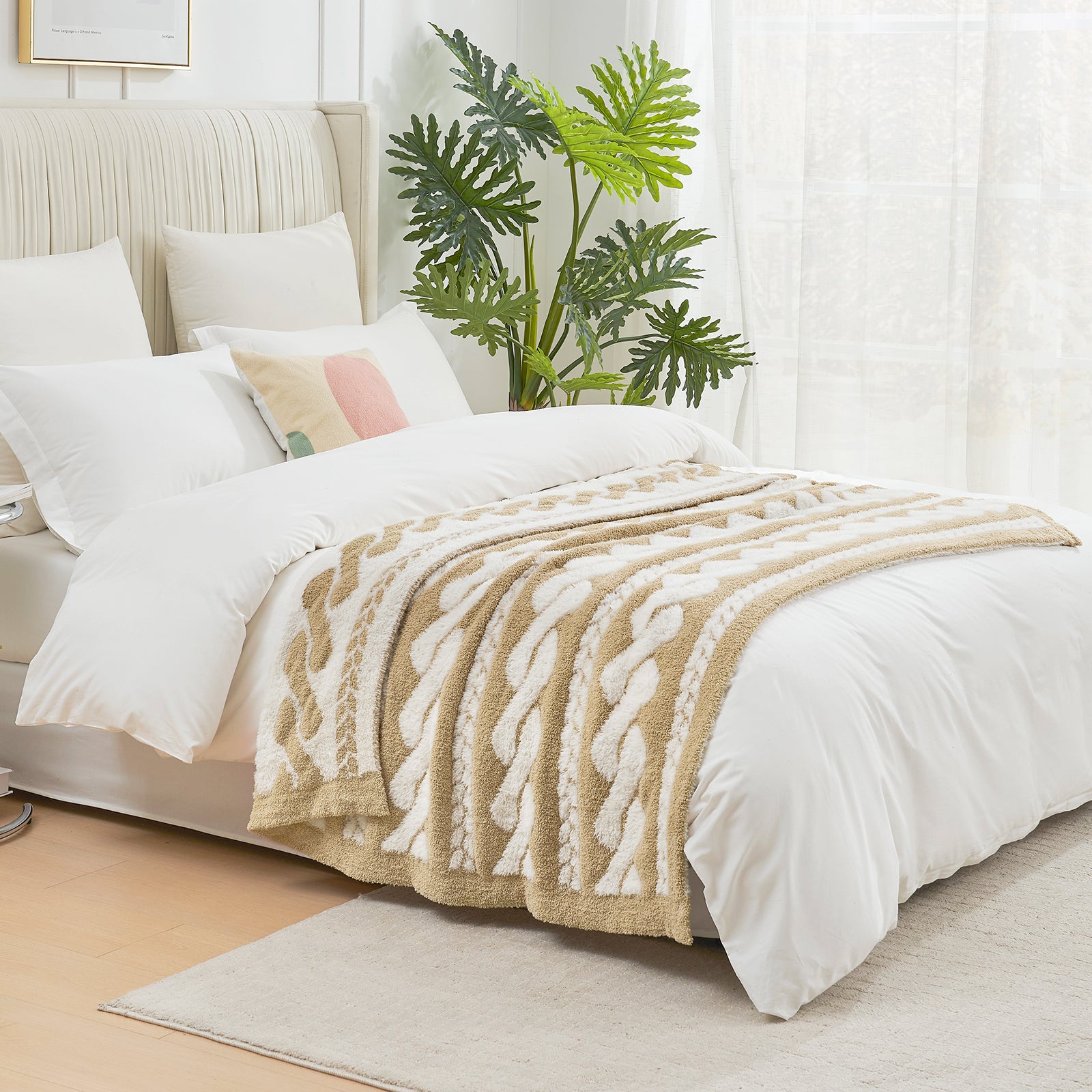 Cable pattern Faux Fur Knit Throw Blanket in beige and white on a bed side view.#color_Beige