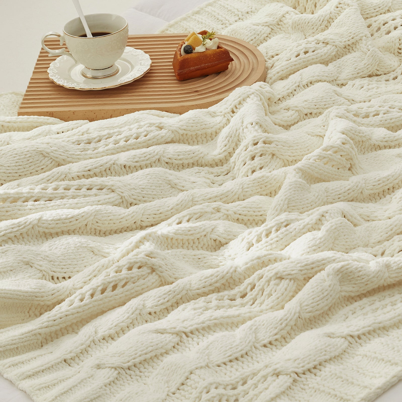 Close up of cable chenille knit throw blanket in Ivory showcasing soft cable knit texture #color_Ivory