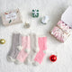 Snuggle Sac women heather plain socks 4 pairs in Pink/Grey/White displayed in a cozy holiday gift setting #color_Pink/Grey/White
