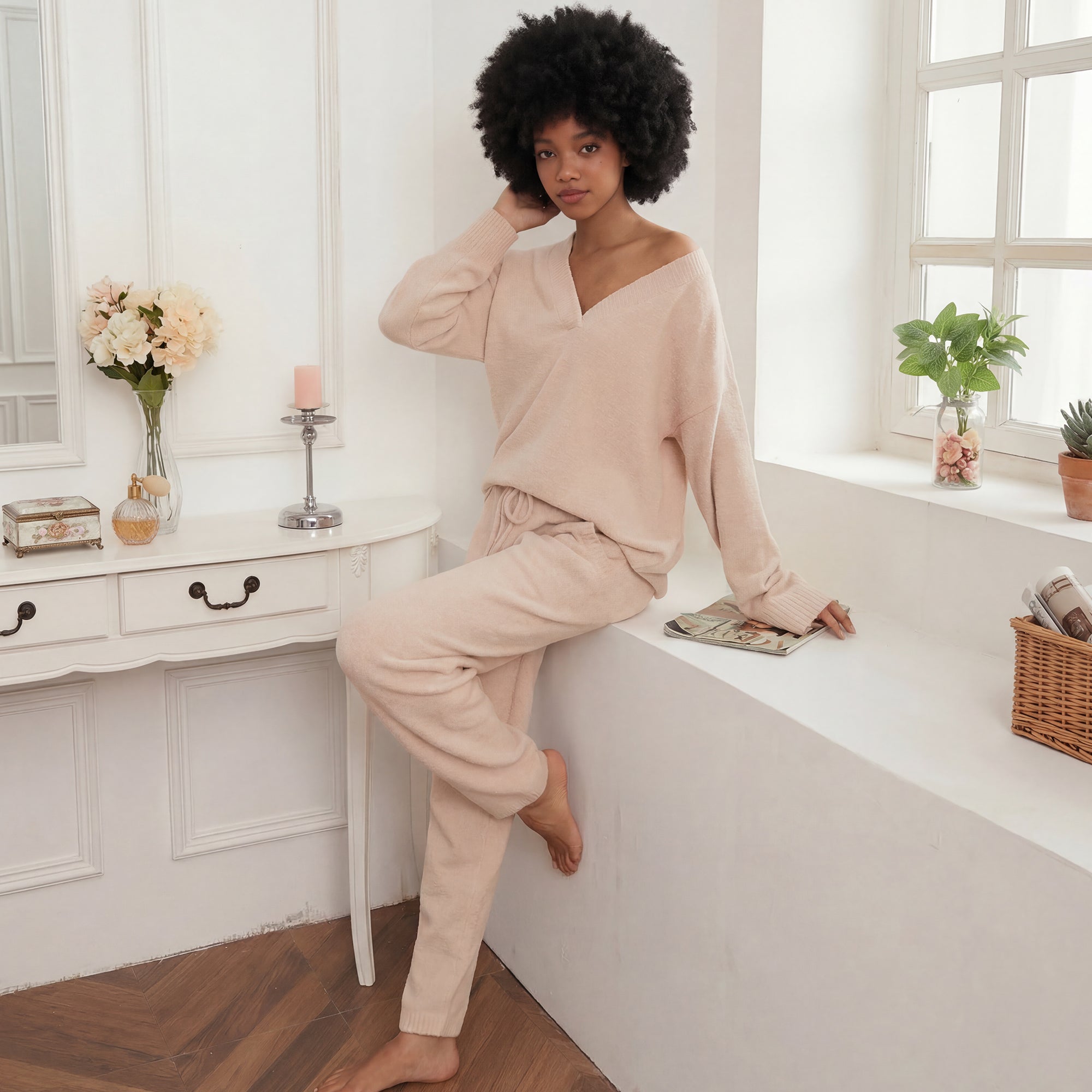 Woman in Snuggle Sac beige outfit sitting on a window. #color_Beige