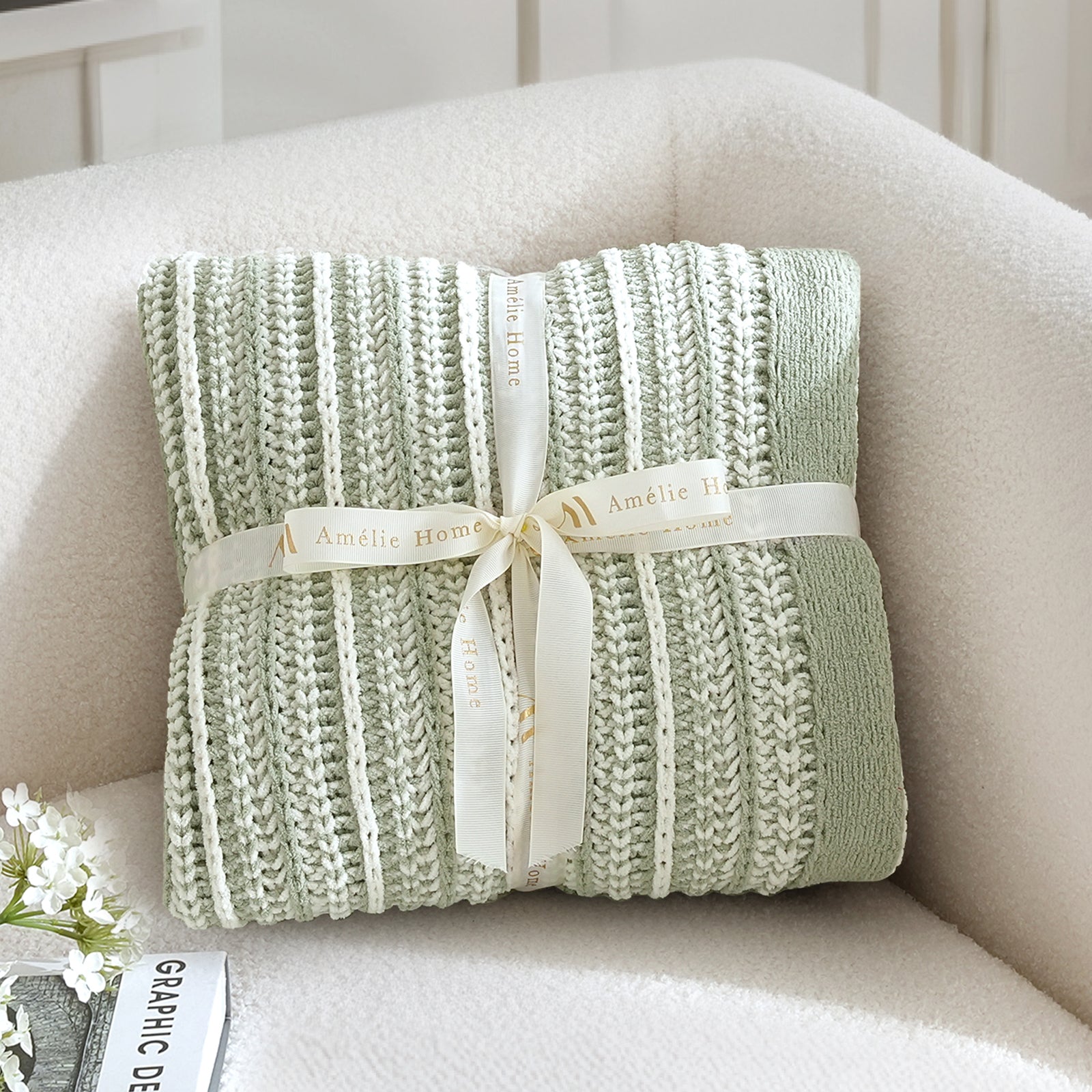 Green knitted blanket with a ribbon on a beige couch #color_Sage Green