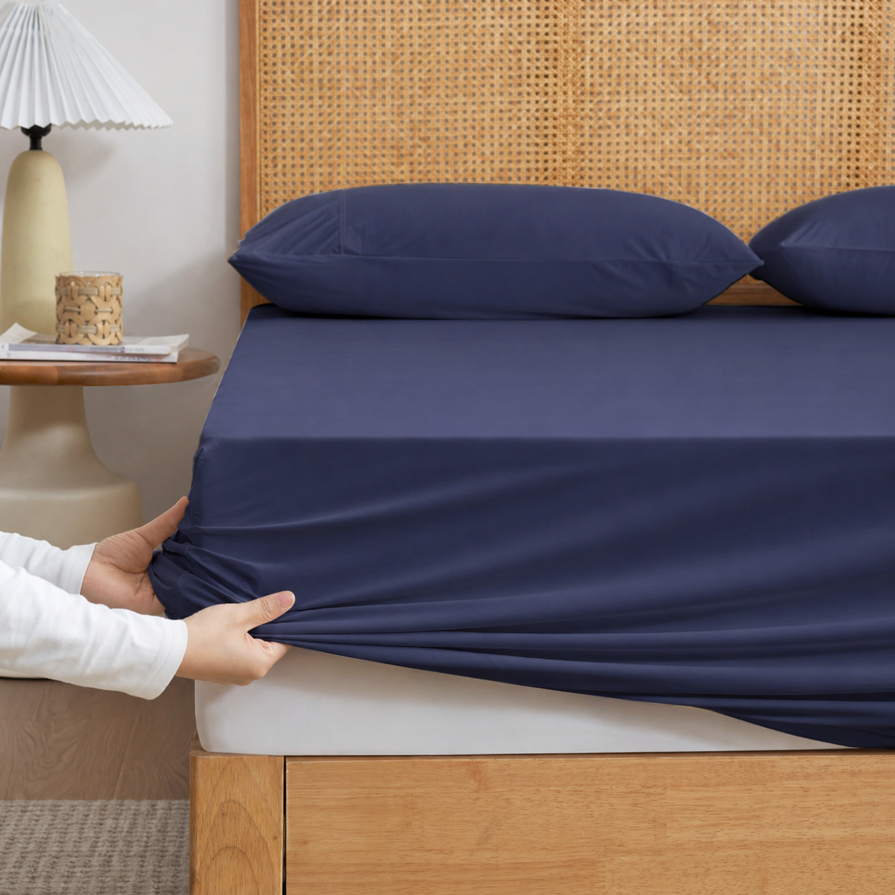 Snuggle Sac Blue-colored cooling fitted sheet set with pillowcases front view. #Color_Dark Blue