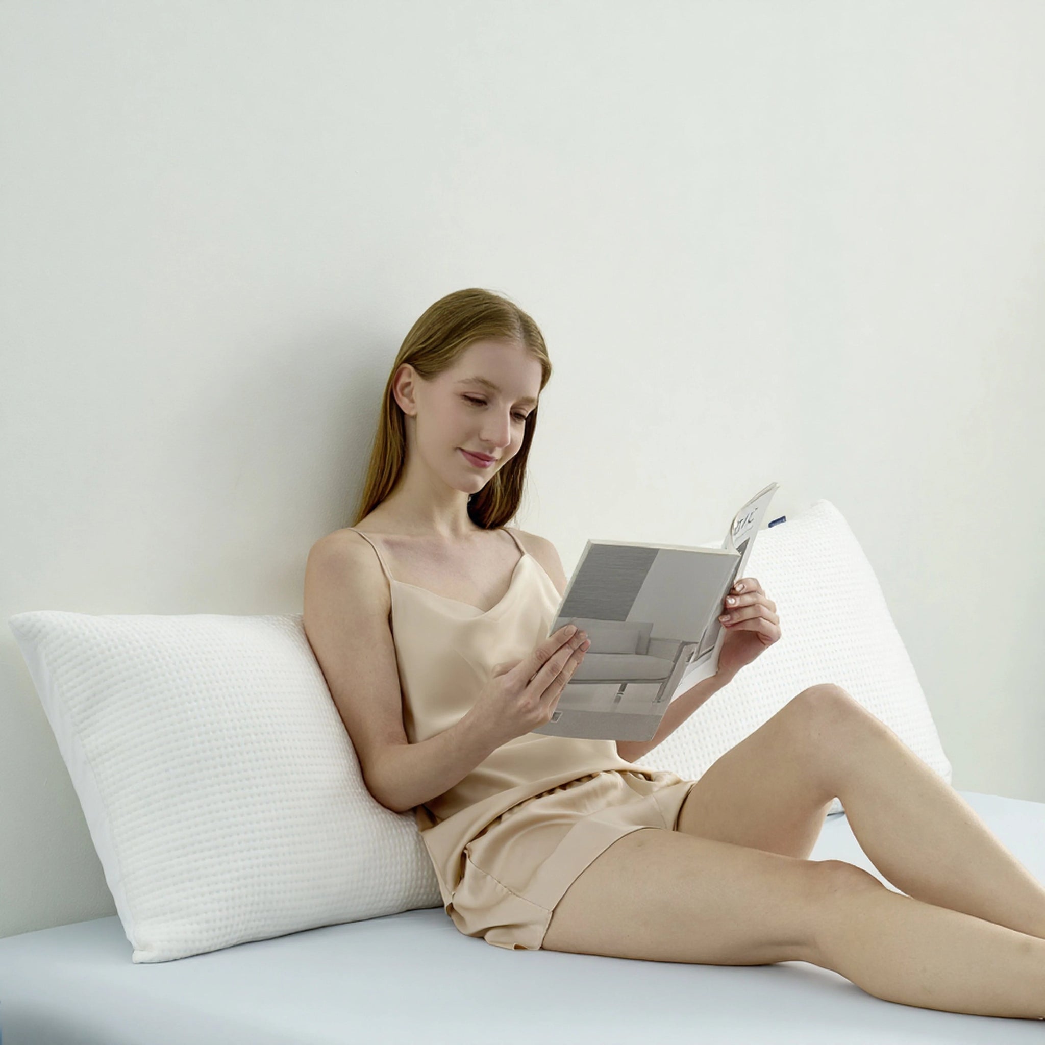 Women reading with body pillow support back. #color_White