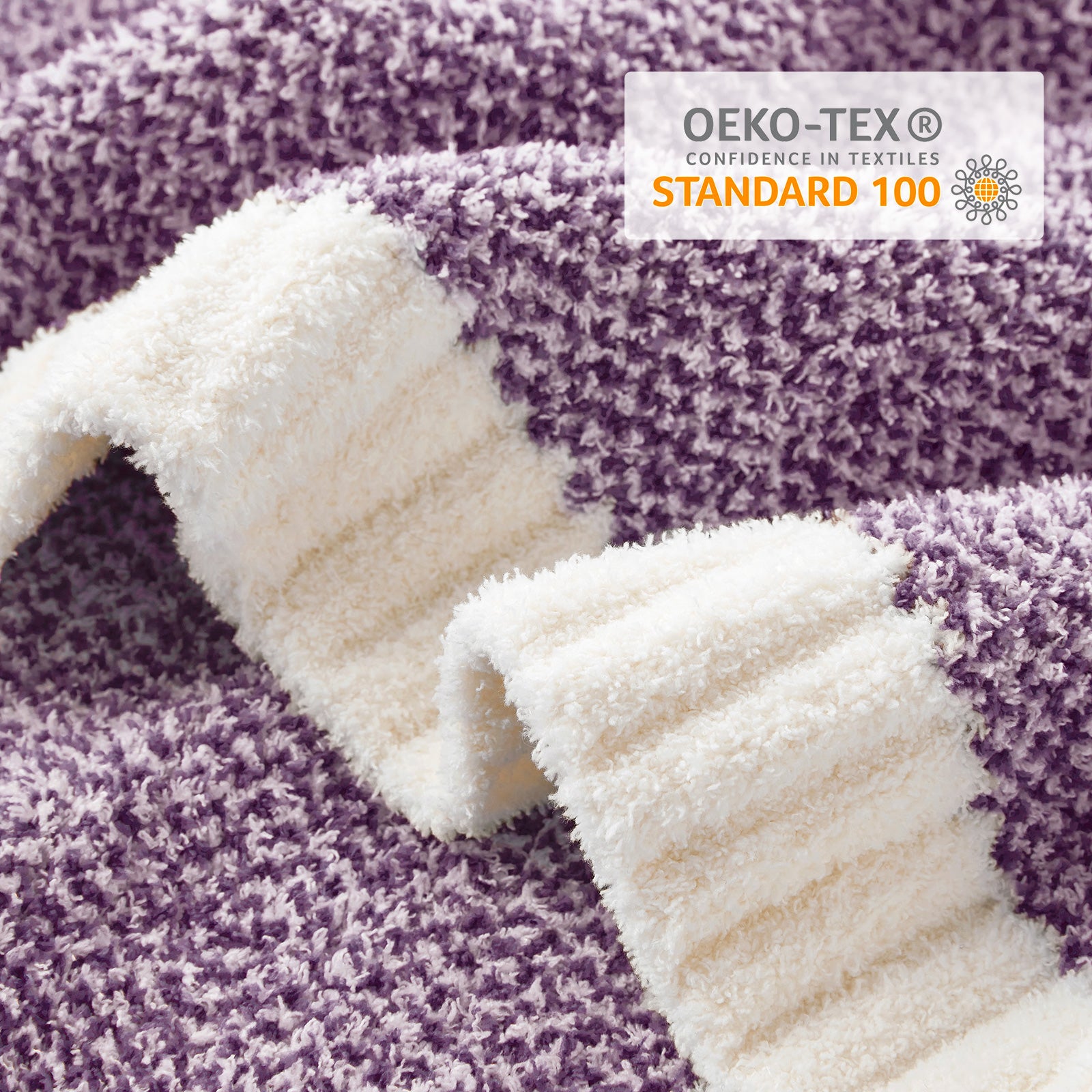 Textured fabric with a purple and white pattern and OEKO-TEX Standard 100  label.#color_Heather Purple