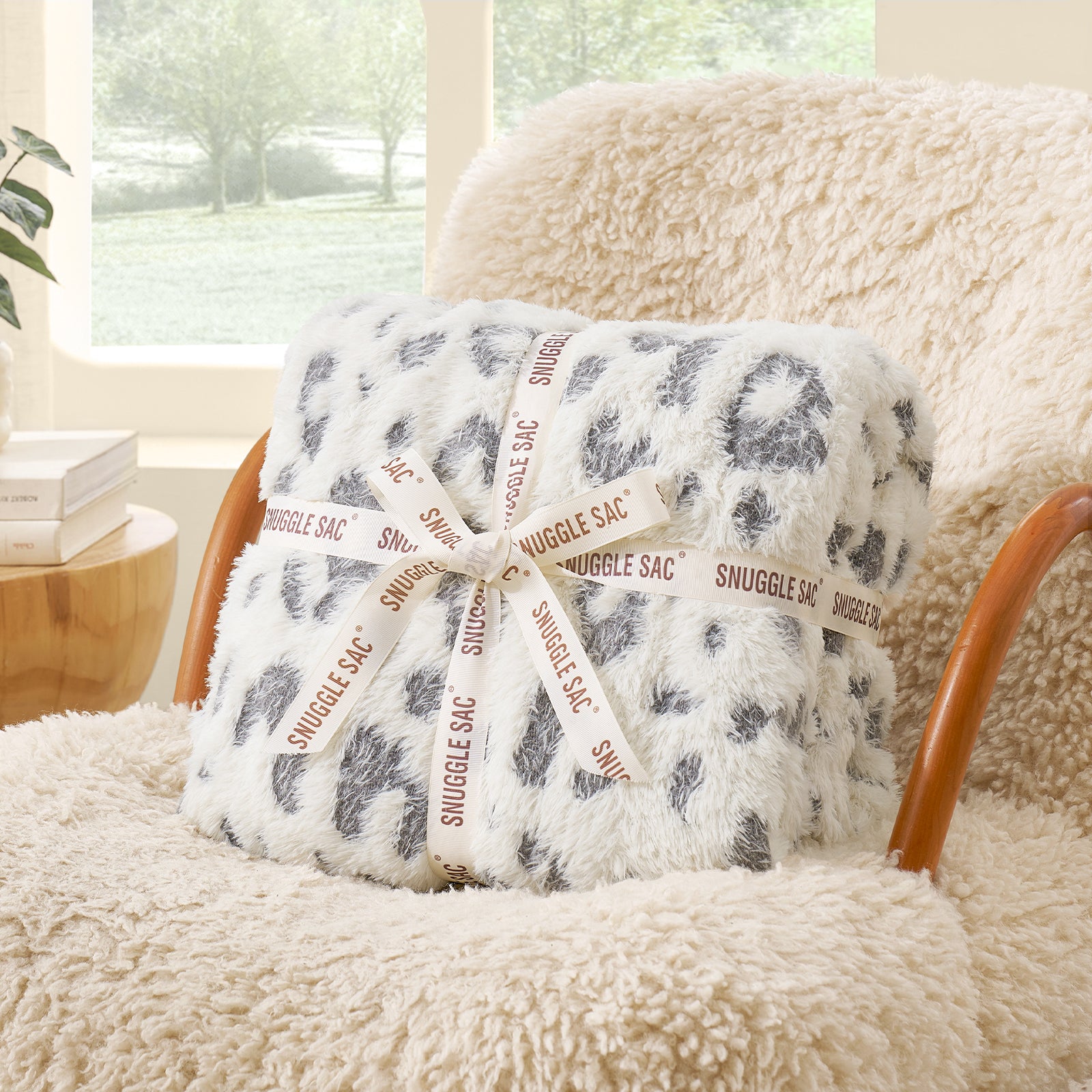 Grey Leopard faux fur knit throw blanket folded with ribbon, perfect for gifting #color_Grey Leopard